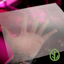Load image into Gallery viewer, On The Grow 10x10 reusable silicone grow medium held under pink LED grow lights showing mesh texture
