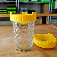 Load image into Gallery viewer, Yellow sprouting jar lid fitted on a 16oz wide mouth mason jar shown upright with lid removed beside it
